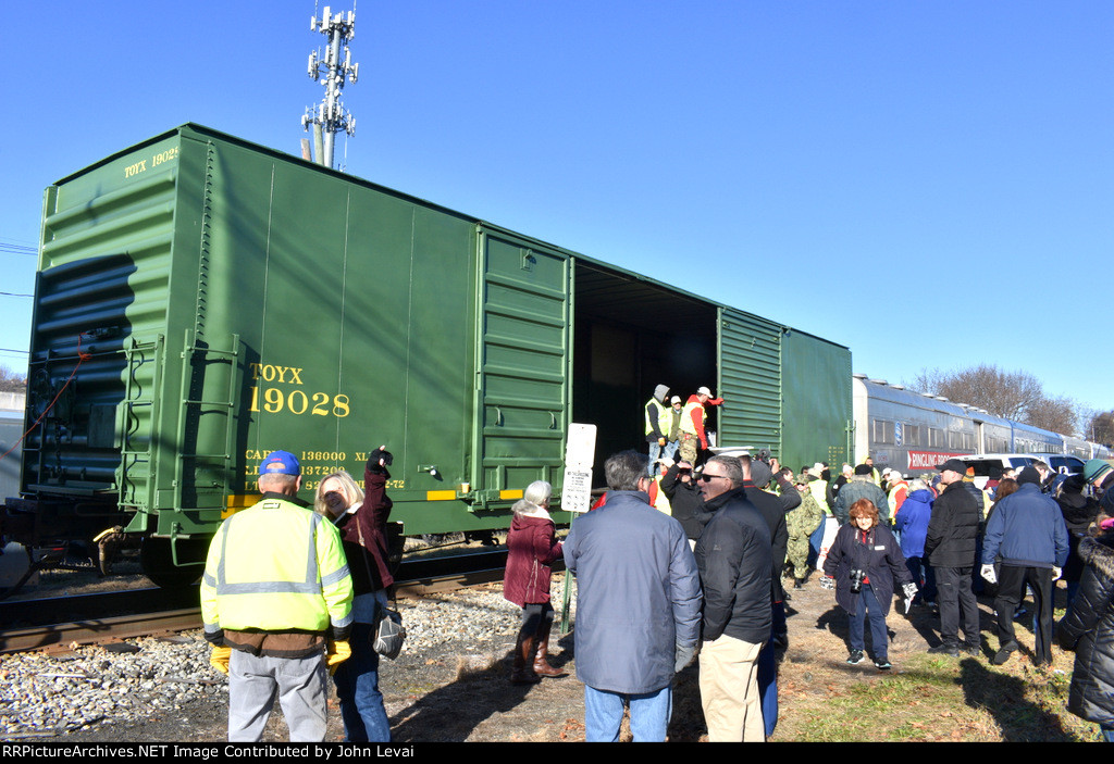 Gifts being loaded into Boxcar # 1775